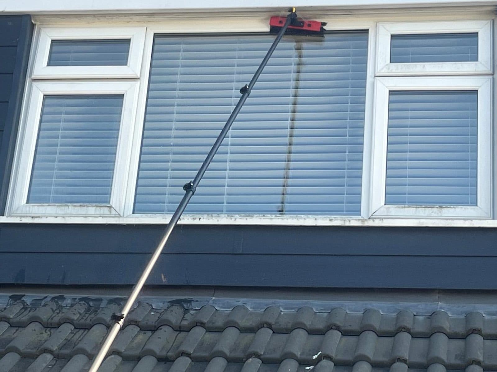 Before — an upstairs dormer window at a Bristol home