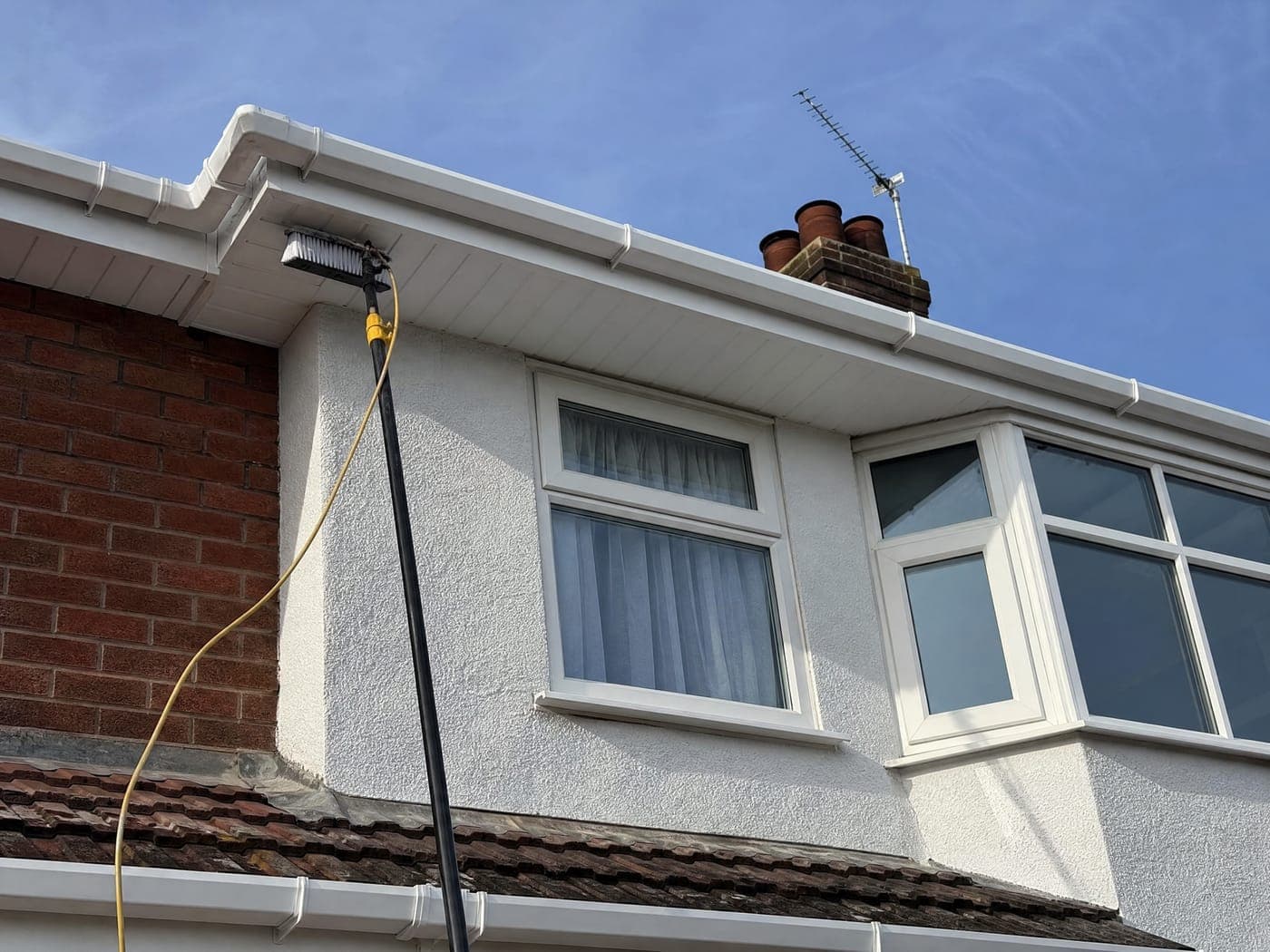 Freshly cleaned bright white uPVC fascia, soffit and guttering on a Bristol home