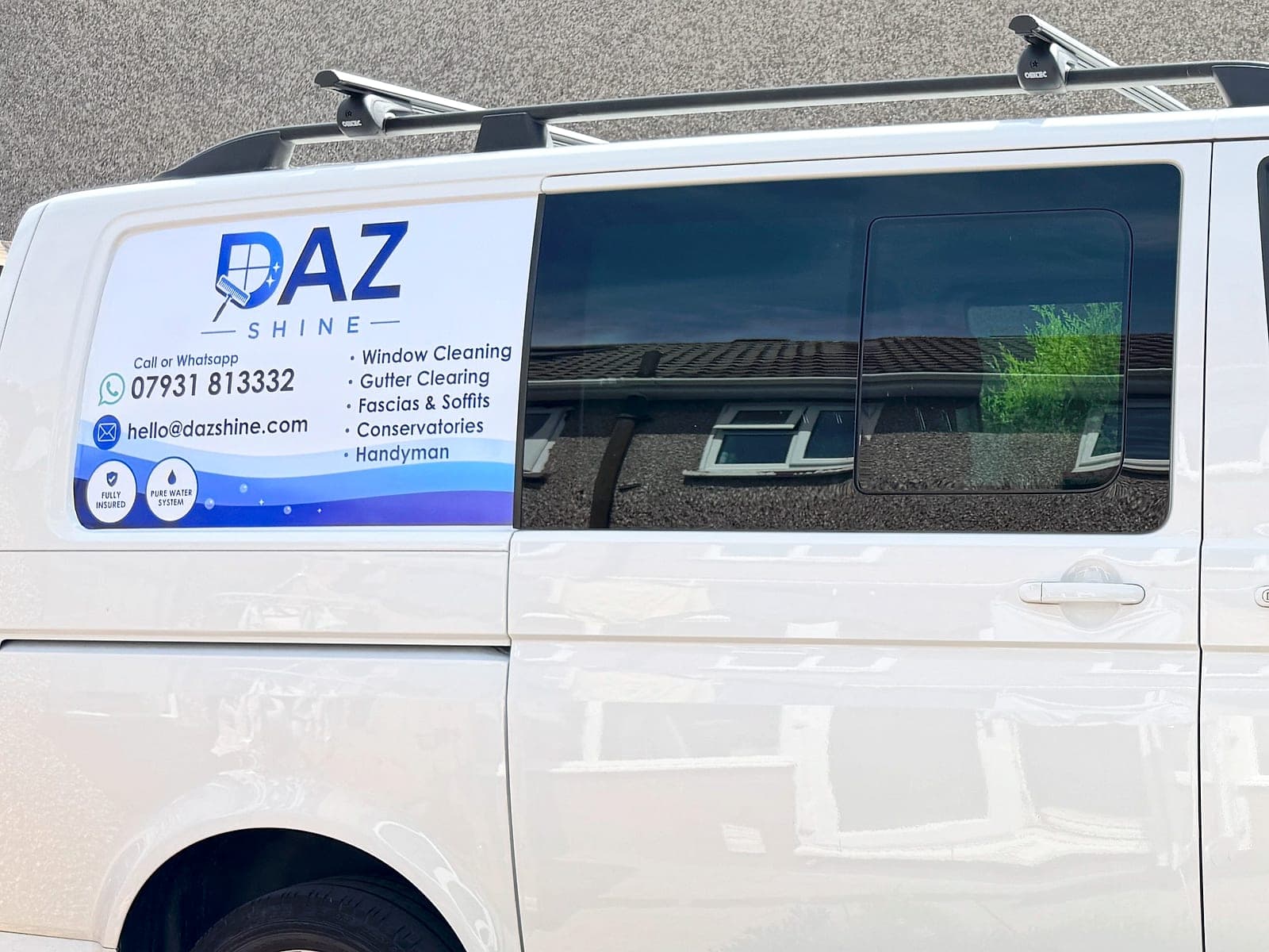 The signwritten Daz Shine van parked at a Bristol home, showing the services offered and the contact number